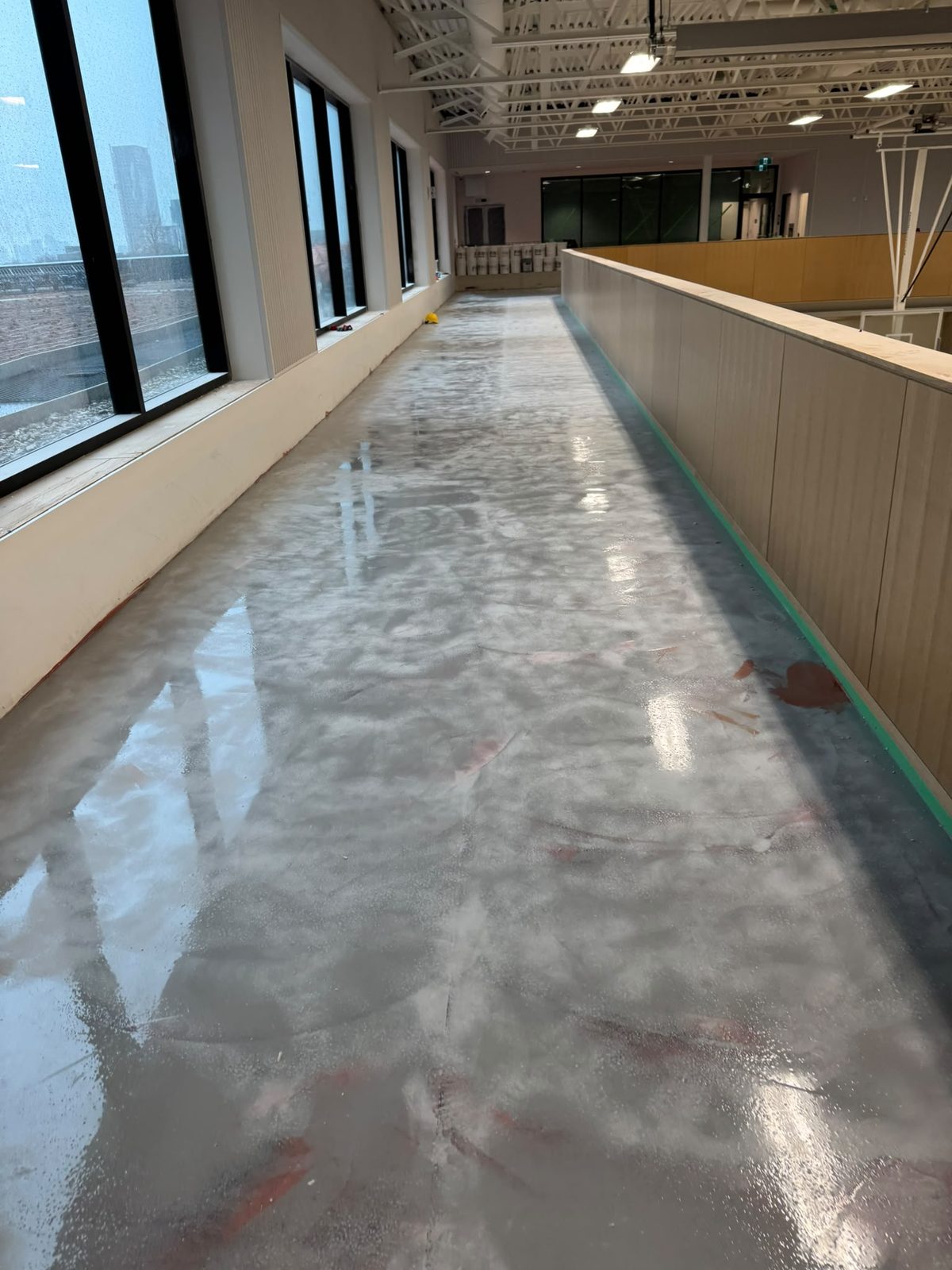 Mezzanine walkway after self-levelling and sealed concrete finish