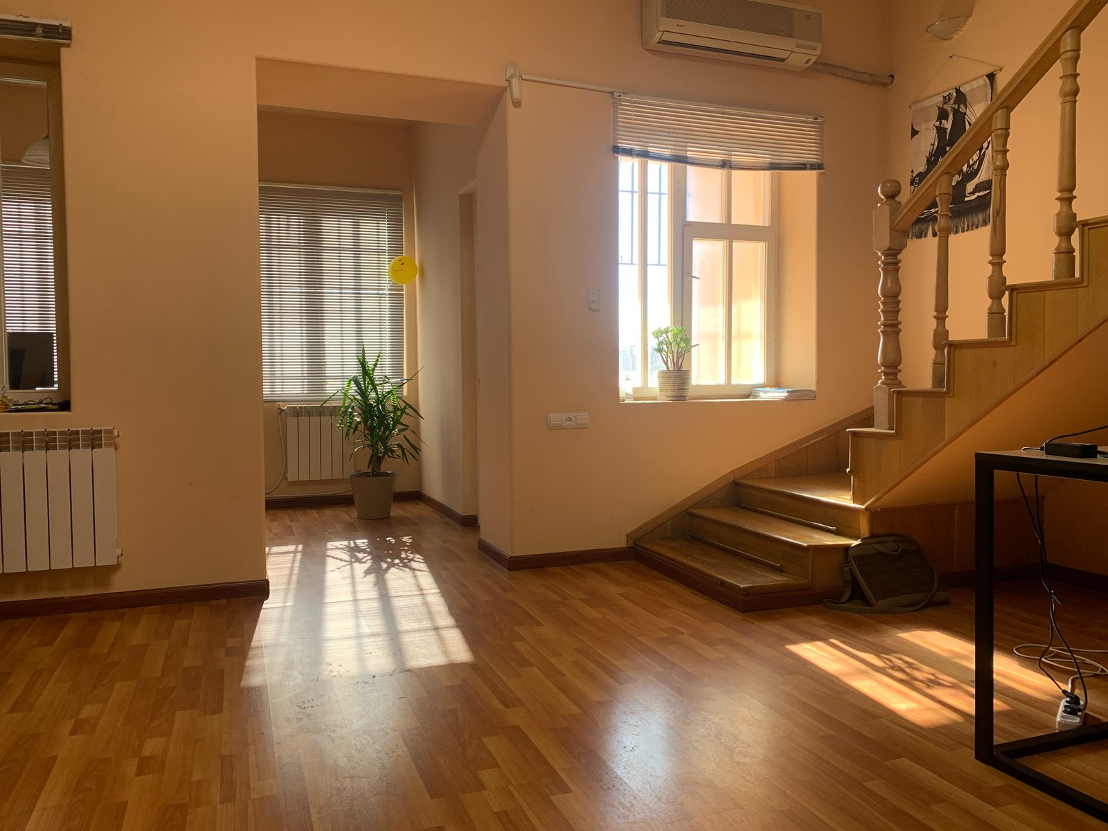 Wooden staircase beside a hardwood landing