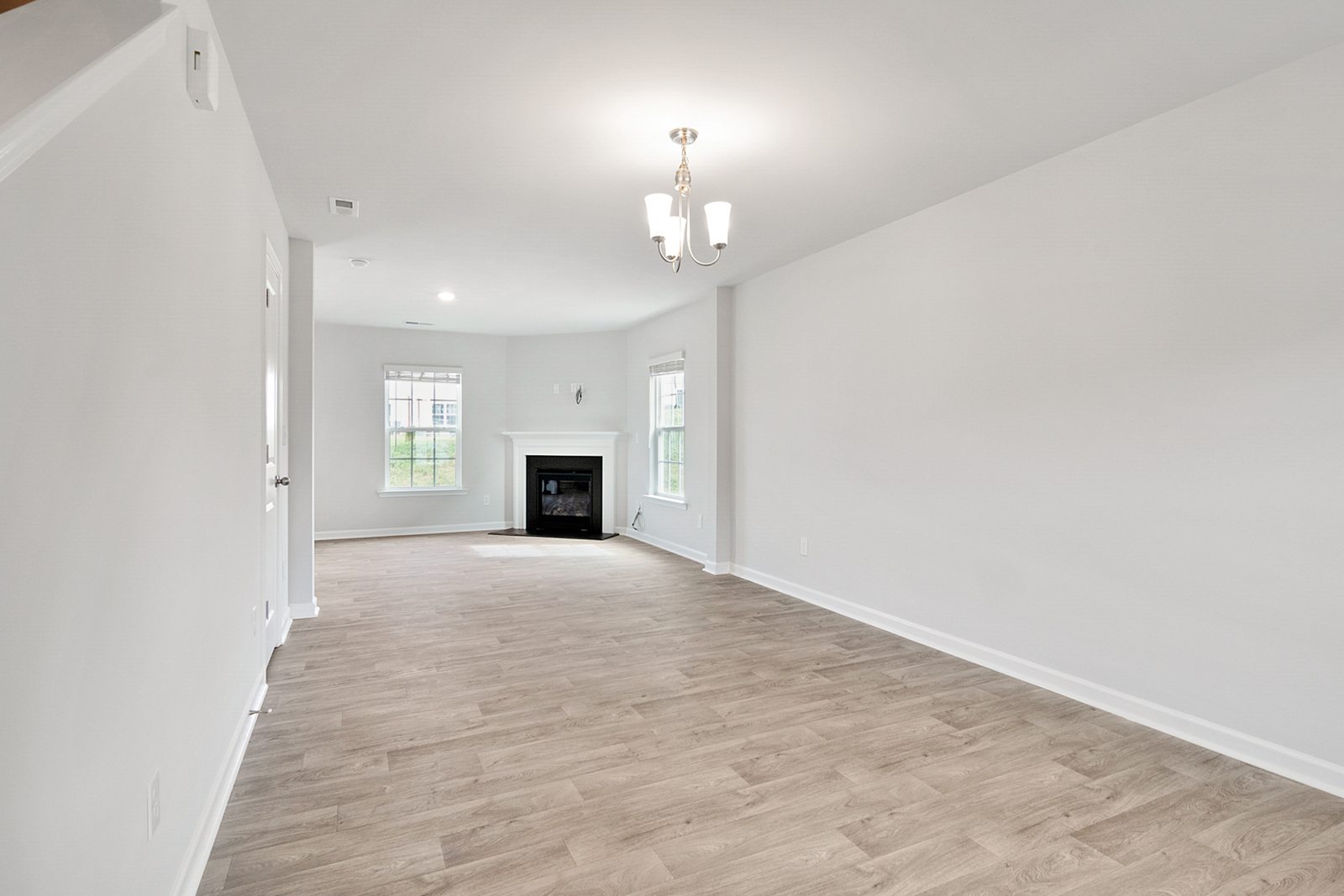Wide-plank luxury vinyl flooring in a bright room
